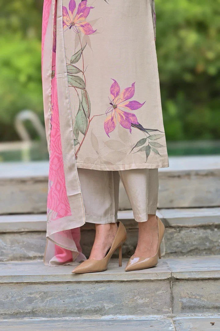 Person wearing a floral outfit with high heels on stone steps